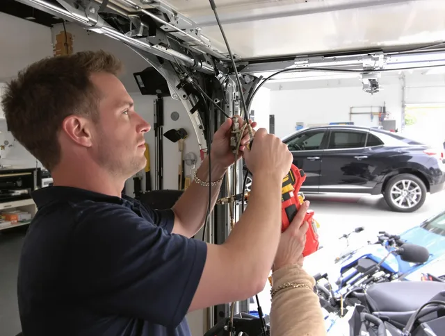 Sharon Garage Door Repair safety certified technician performing cable replacement in Sharon