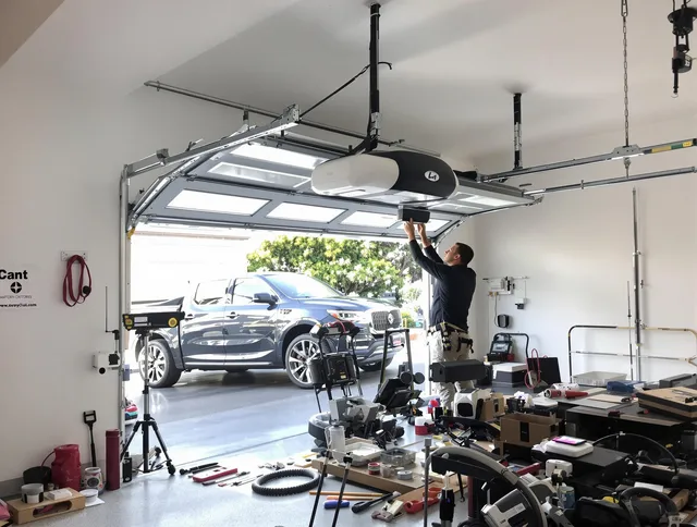 Sharon Garage Door Repair specialist installing smart garage door opener system in Sharon home