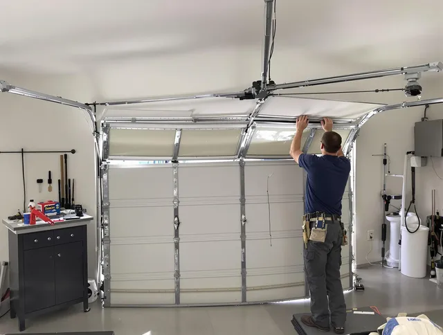Sharon Garage Door Repair specialist performing precise section replacement on Sharon garage door
