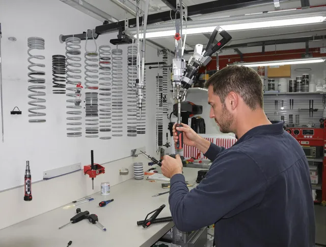 Sharon Garage Door Repair safety certified technician performing precision spring replacement in Sharon