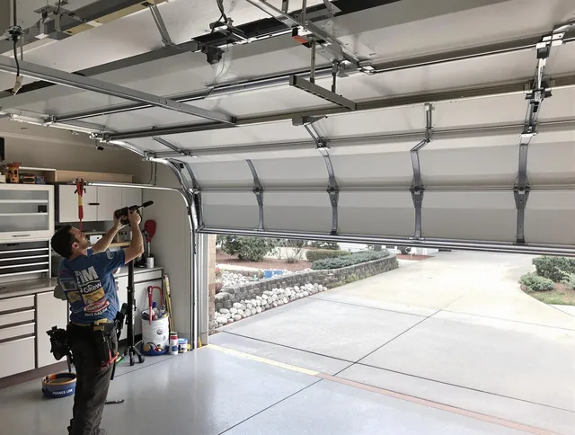Garage door track repair service by Sharon Garage Door Repair in Sharon